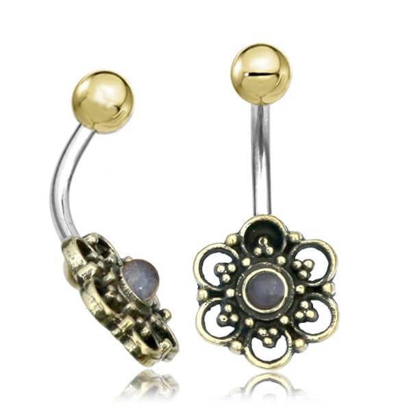 naval belly button piercing with intricate flower design with moonstone centrepiece and brass ball