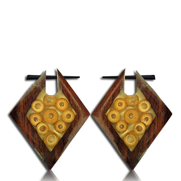 Two earrings made of narra wood featuring a diamon shape