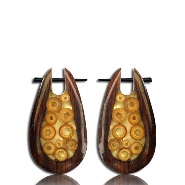 Two narra wood earrings featuring a droplet design on a white background