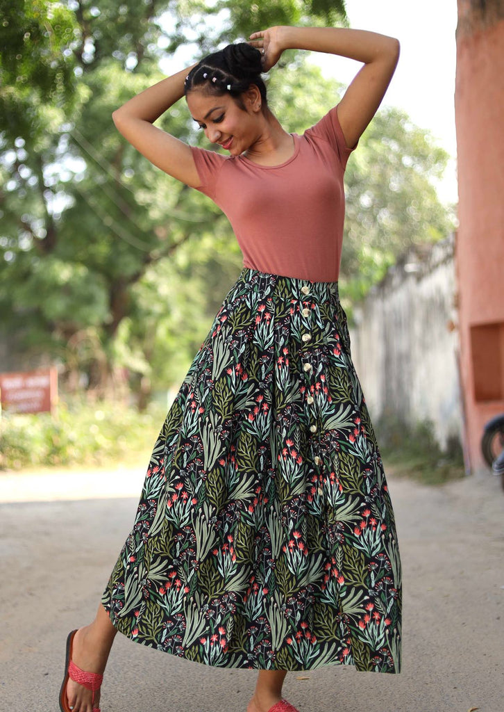 Model wearing a long karma east skirt