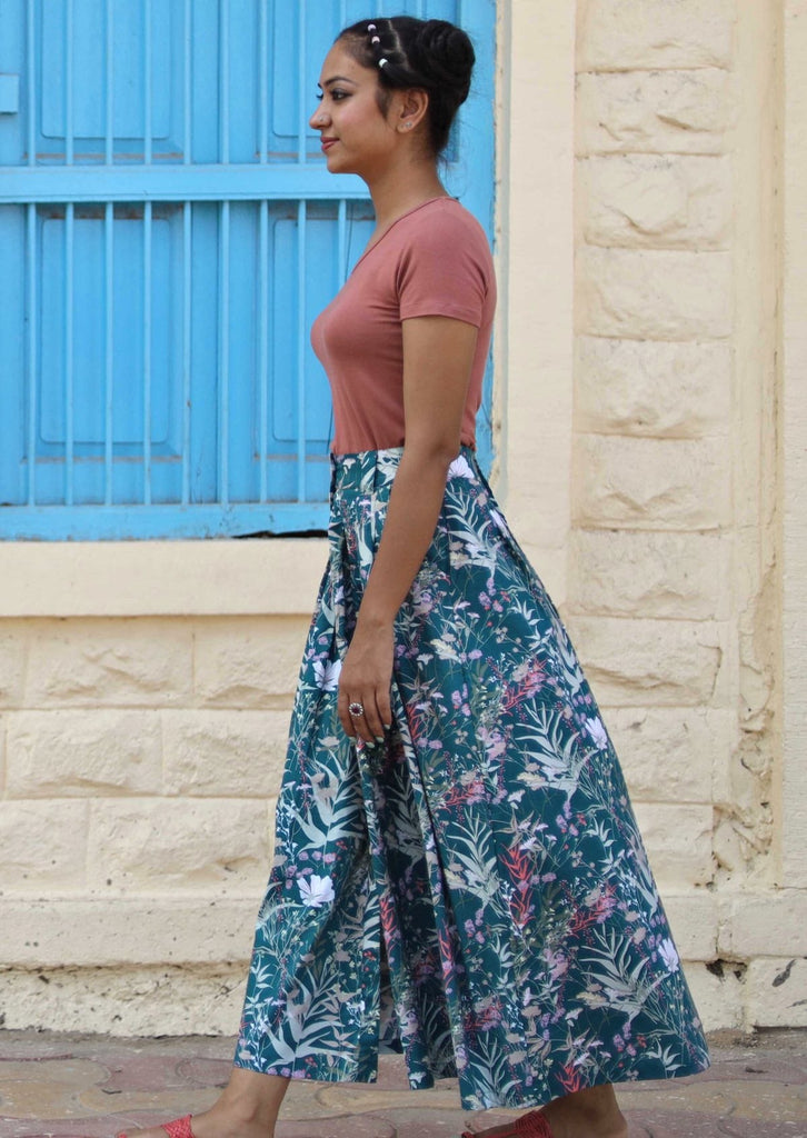 Model wearing a long nature-inspired skirt