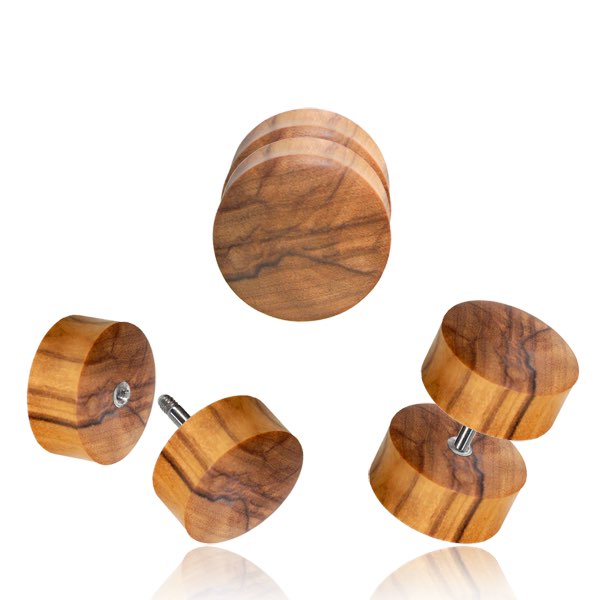 Three fake plugs made from olive wood on a white background