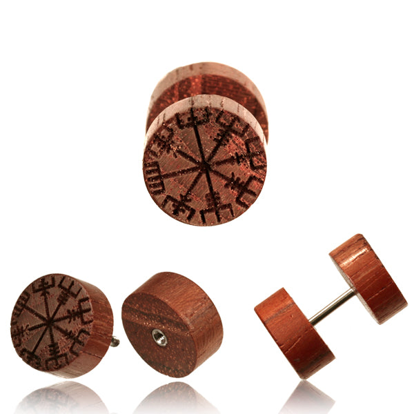 Three Rose wood fake plugs decorated with snow motifs on a white background