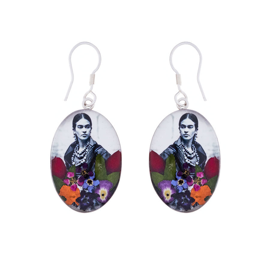 san marco silver and resin pendant earrings featuring a photograph of frida kahlo adorned with colourful dried flowers