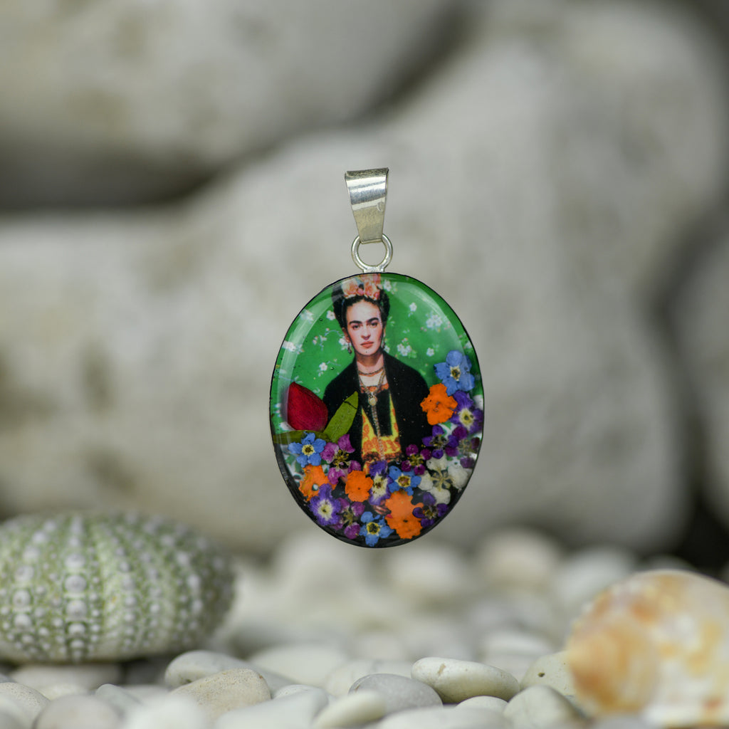 san marco silver and resin pendant with photograph of frida kahlo wearing flowers in her hair adorned with colourful dried flowers set in resin