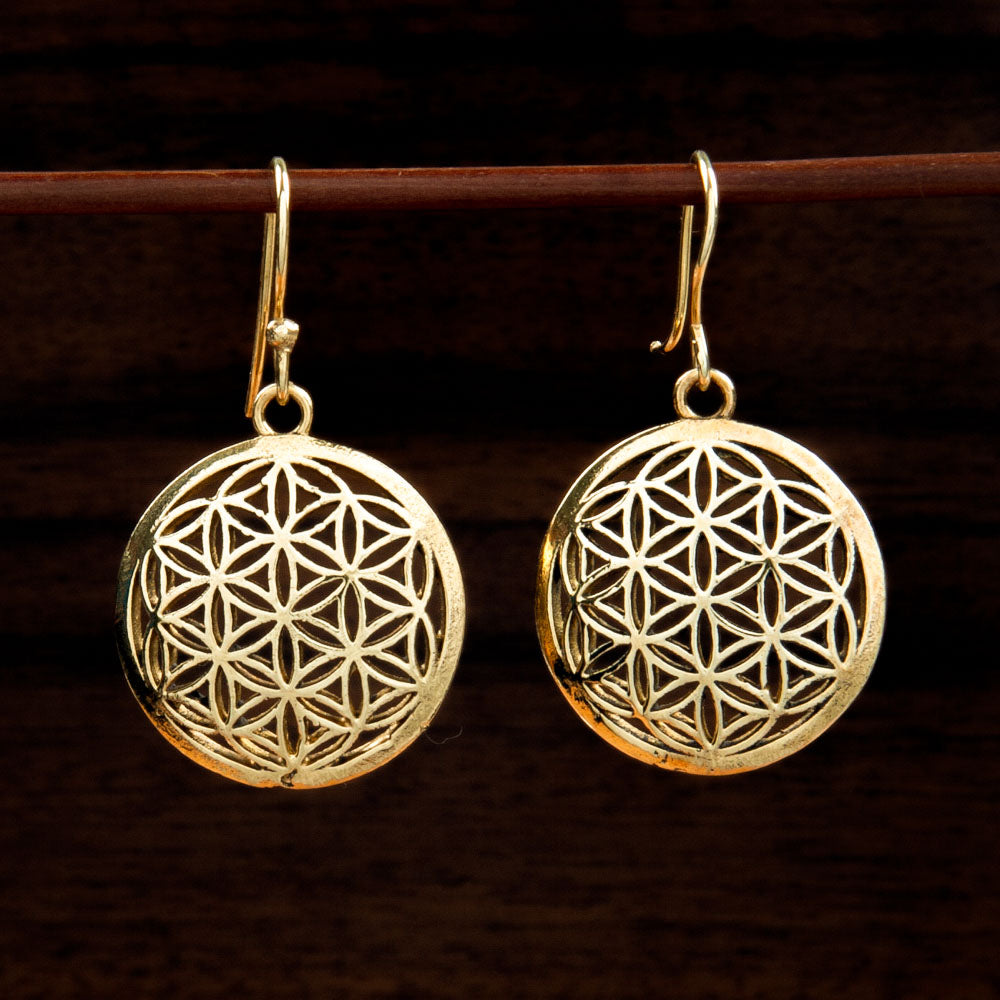 Two brass earrings decorated with Flower of Life motif