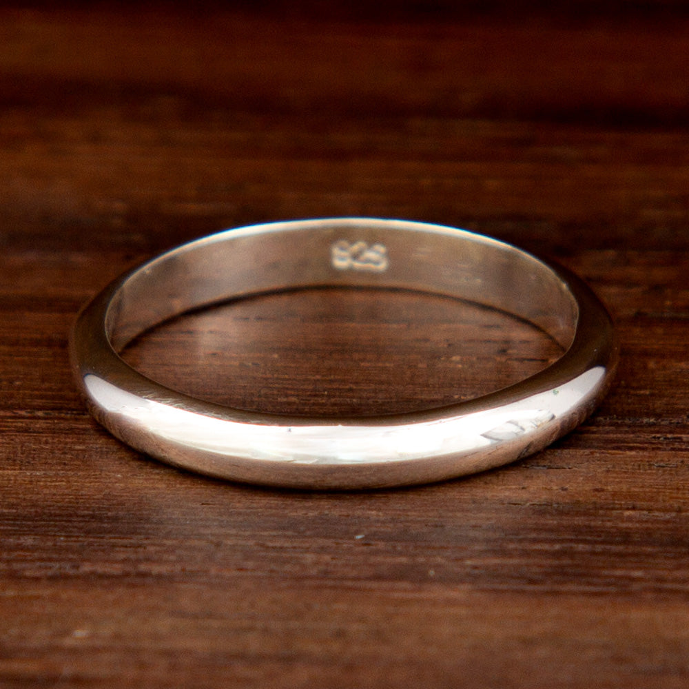 Silver mid-finger ring featuring a thin band design