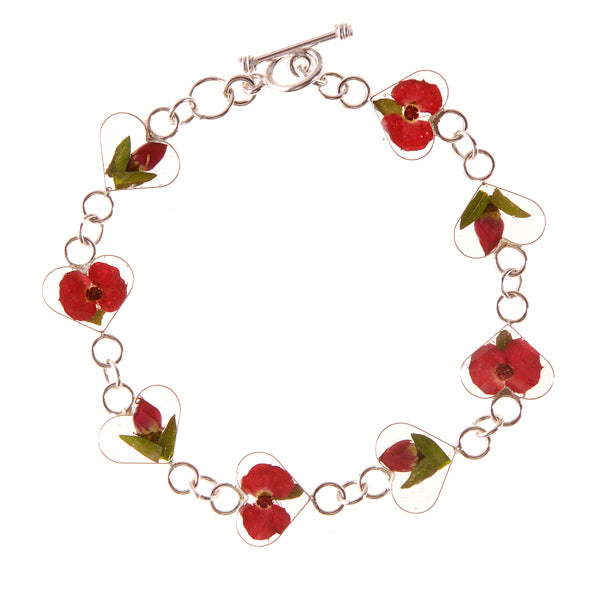 san marco silver and resin bracelet with deep red crimson dried flowers encased in the resin of eight small heart shaped sections and joined by silver links
