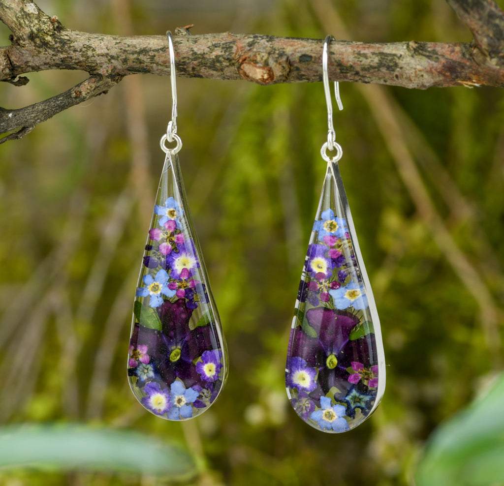 san marco large teardrop shaped silver and resin earrings with dried purple and complementary coloured flowers encased in the resin