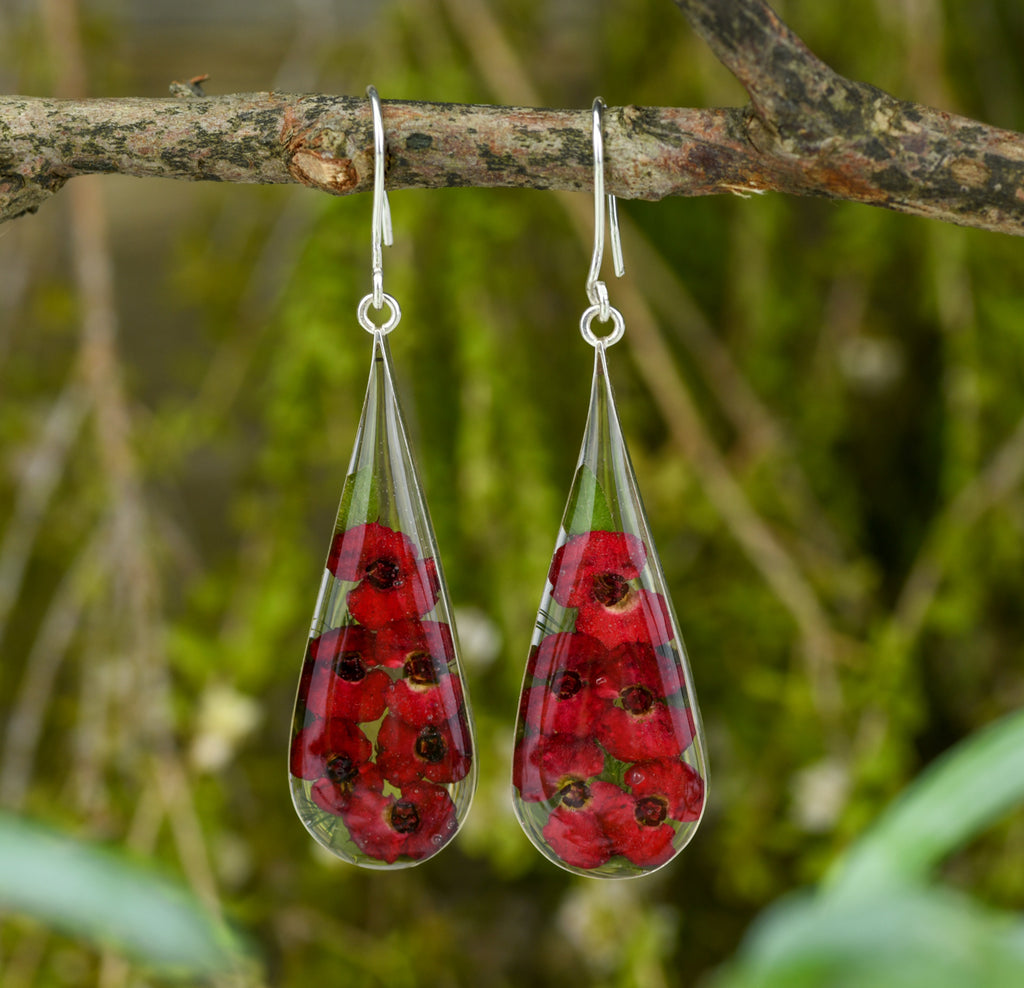 san marco large teardrop shaped silver and resin earrings with dried red flowers encased in the resin