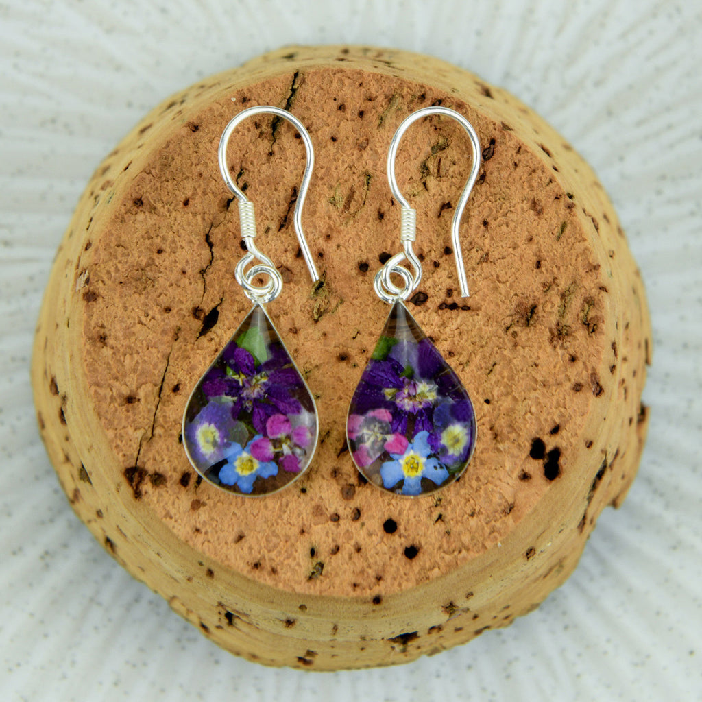 san marco small droplet shaped silver and resin earrings with purple and complementary coloured dried flowers encased in the resin