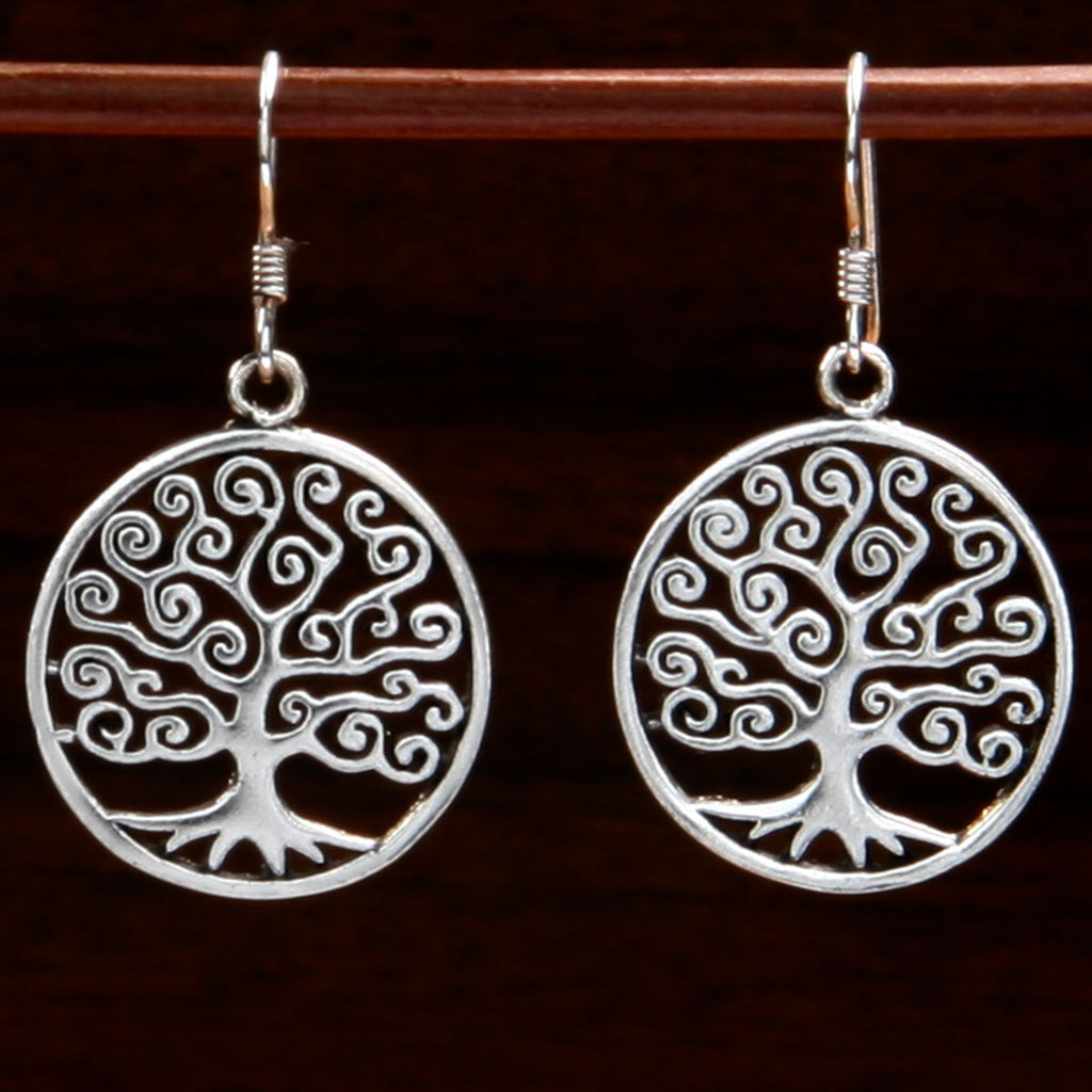 sterling silver pendant earrings with swirly tree of life design silhouetted inside a circle