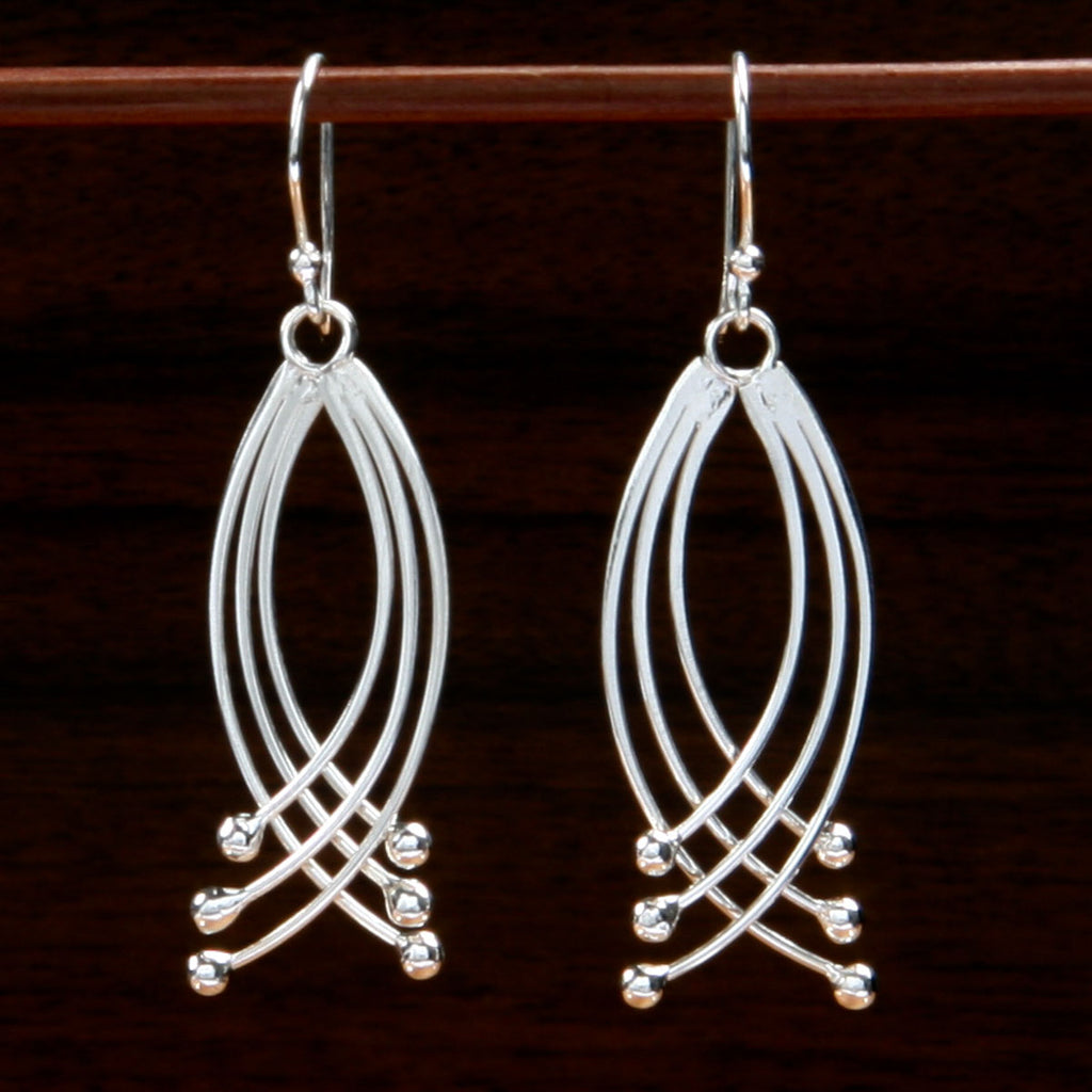 sterling silver curved illusion earrings inspired by celtic triquetra