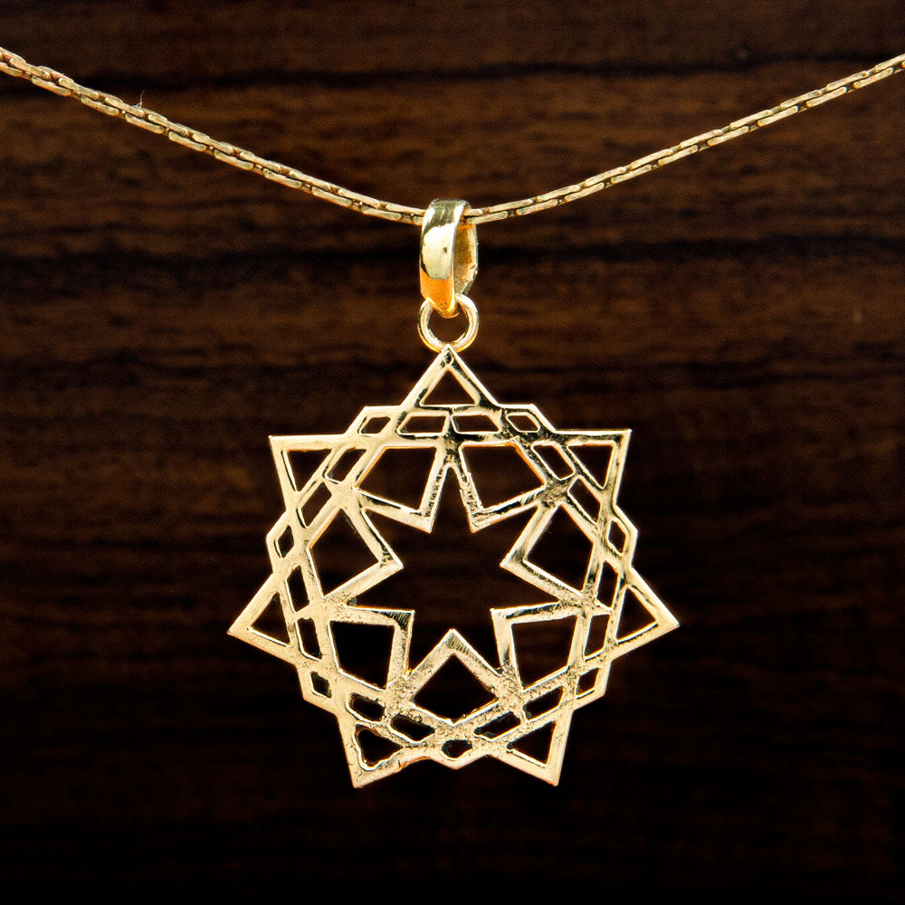 A brass pendant featuring a Star design on a wooden background