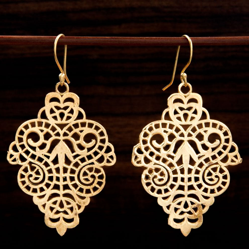 brass earrings with intricate indian design and arrow motif