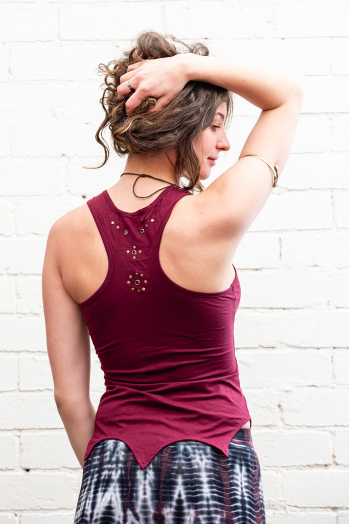 Maroon Freyja lace-up singlet top with pointed hem line and brass detailing back